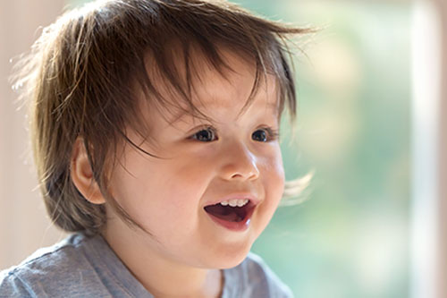 Happy little toddler boy with a big smile at a Preschool & Daycare Serving New Braunfels, TX