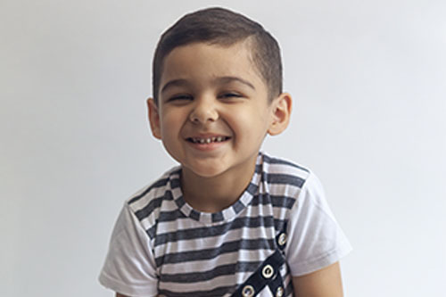 Innocent smiling little boy at a Preschool & Daycare Serving New Braunfels, TX