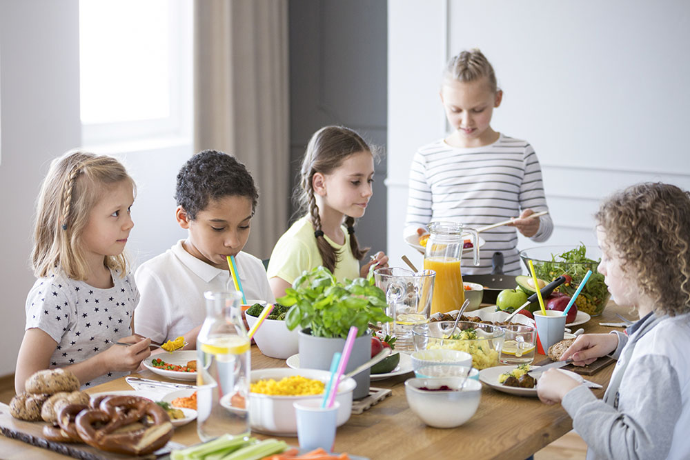 Children enjoying a healthy meal at a Preschool & Daycare Serving New Braunfels, TX