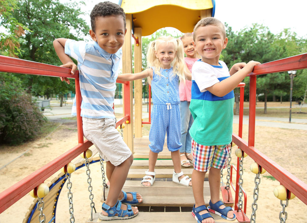 Cute children on playground at a Preschool & Daycare Serving New Braunfels, TX