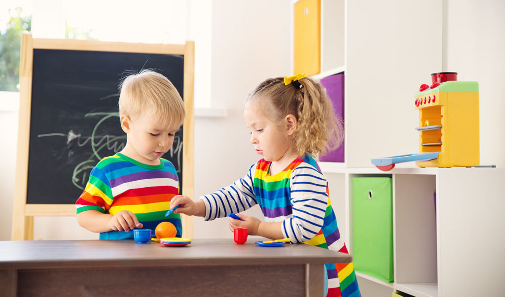 Little child playing with toys in kindergarten at a Preschool & Daycare Serving New Braunfels, TX