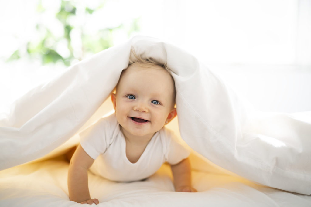 smiling baby girl at a Preschool & Daycare Serving New Braunfels, TX