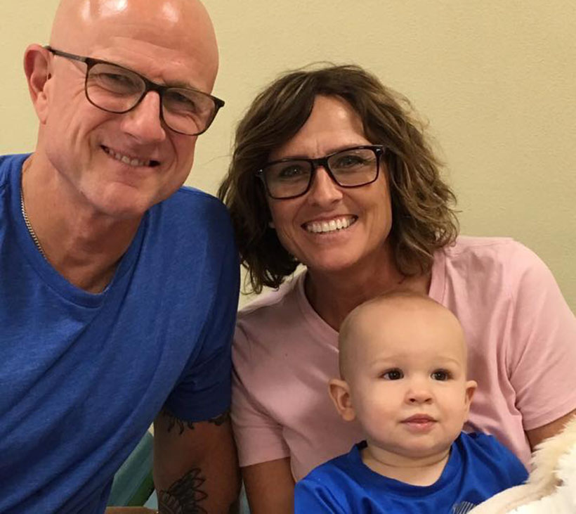 smiling baby with parents at a Preschool & Daycare Serving New Braunfels, TX